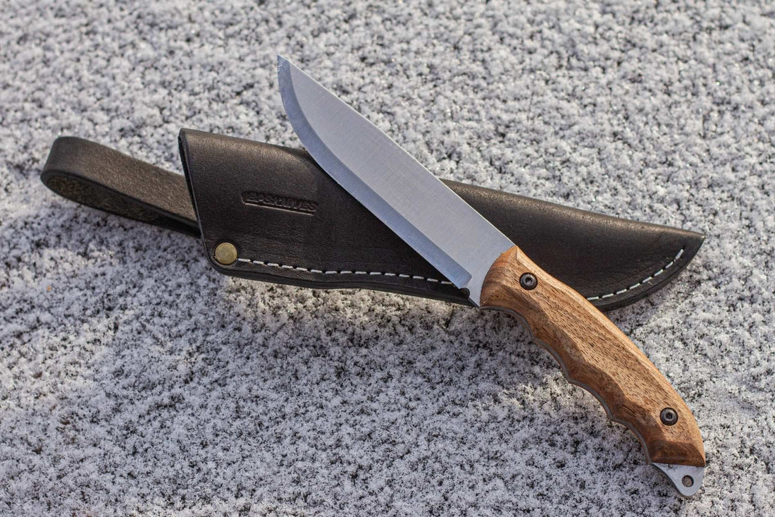 Knife accessories for hiking laid out on a surface