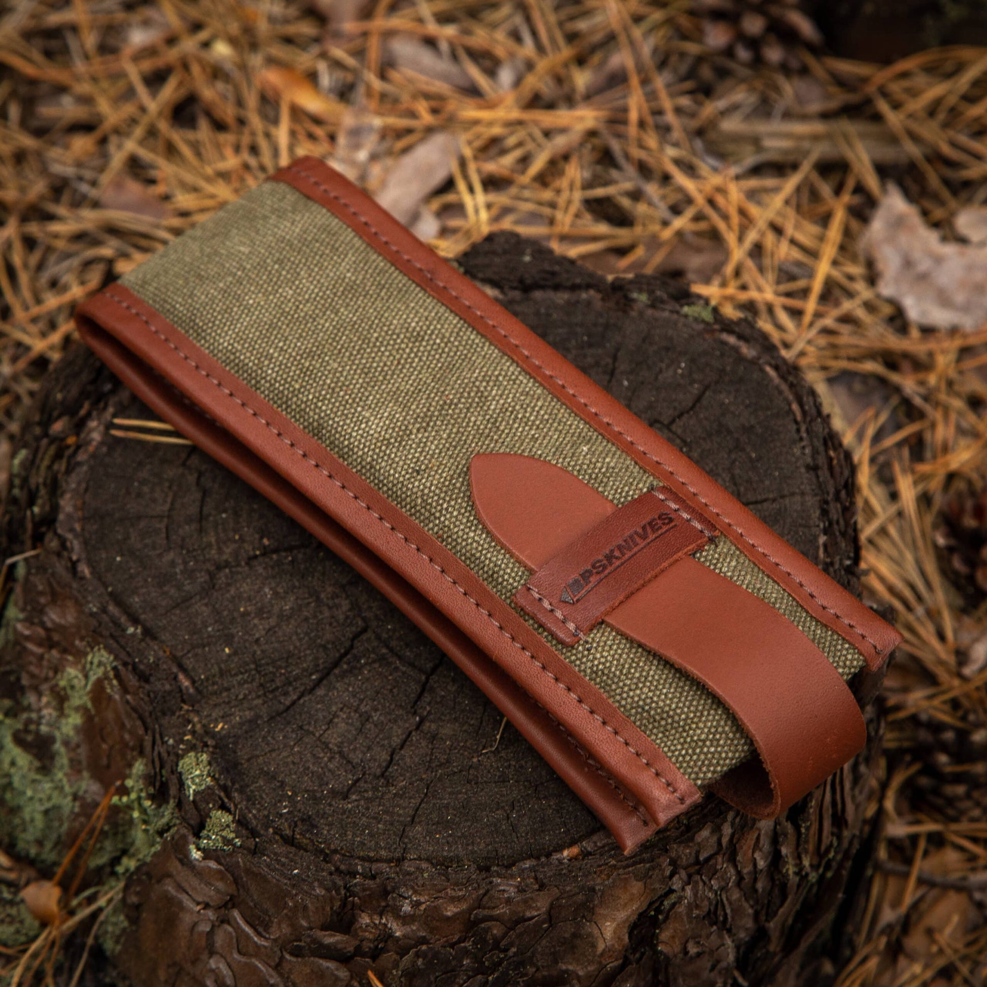 Green fabric belt with brown leather strap 